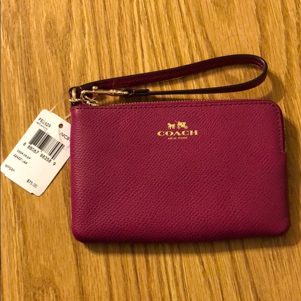 Coach wristlet, hot pink, new with tags.